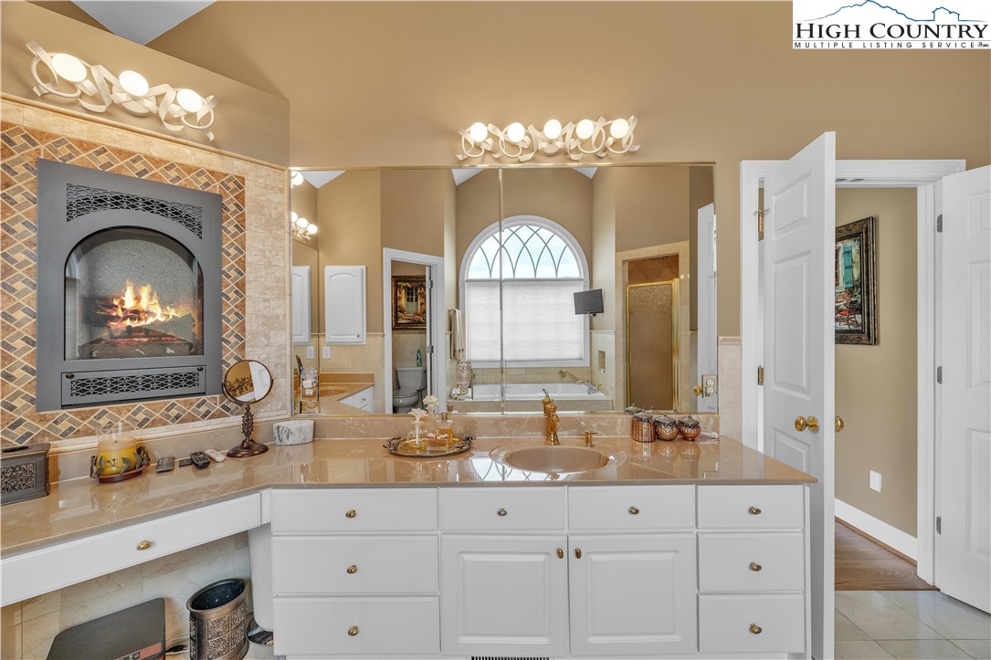 891 Olde Charter Circle Jefferson, NC 28640 - Photo 23 of 49 a large bathroom with double vanity and a mirror