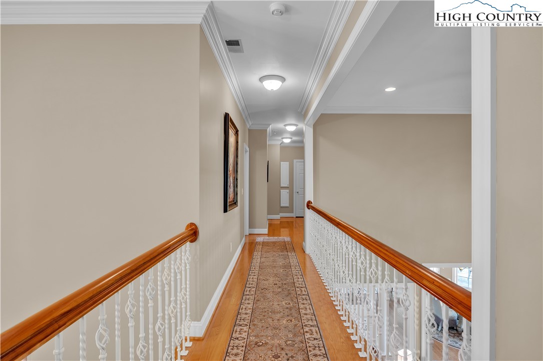 891 Olde Charter Circle Jefferson, NC 28640 - Photo 30 of 49 a view of a hallway with wooden floor and staircase