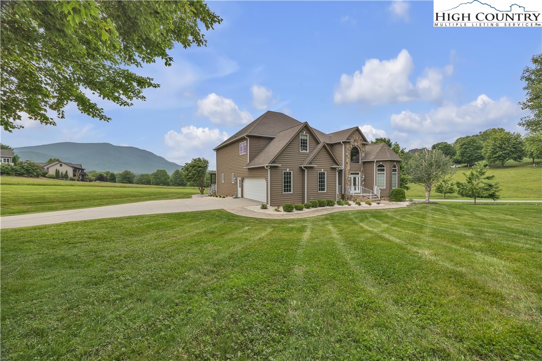 891 Olde Charter Circle Jefferson, NC 28640 - Photo 3 of 49 a view of a house with a big yard