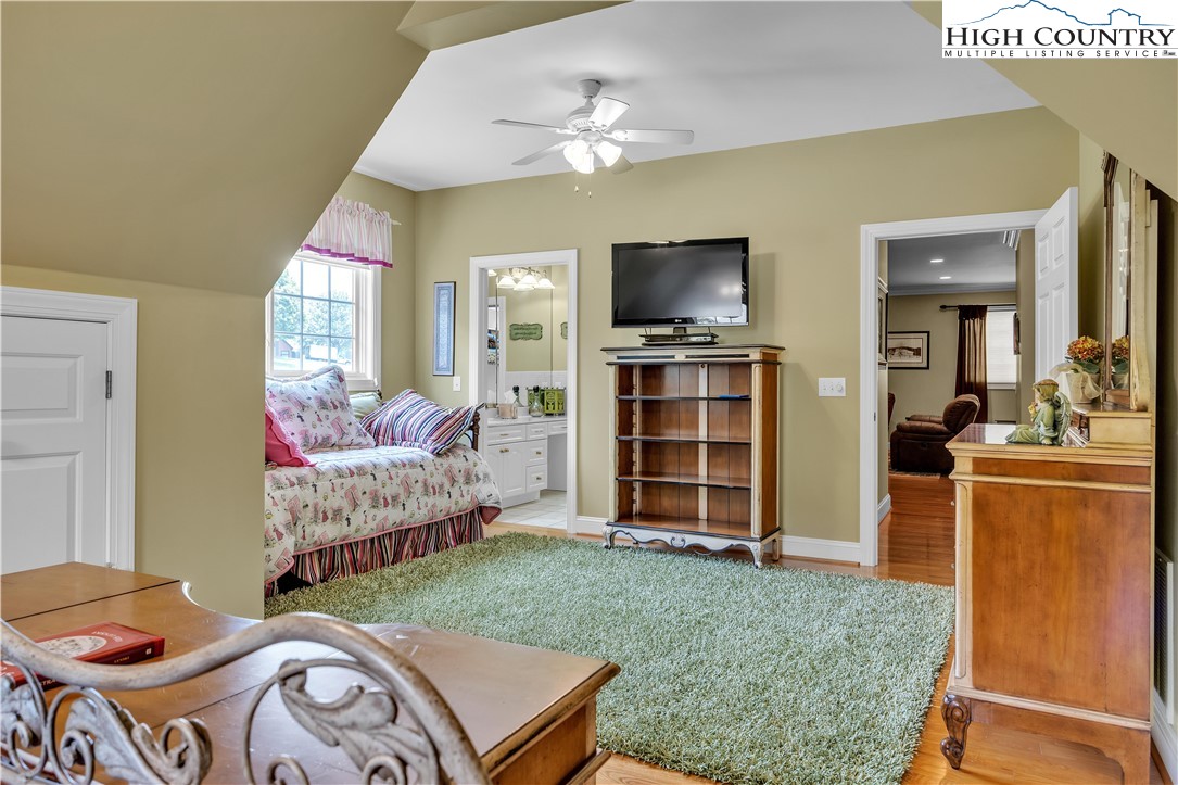 891 Olde Charter Circle Jefferson, NC 28640 - Photo 34 of 49 a living room with furniture and a flat screen tv