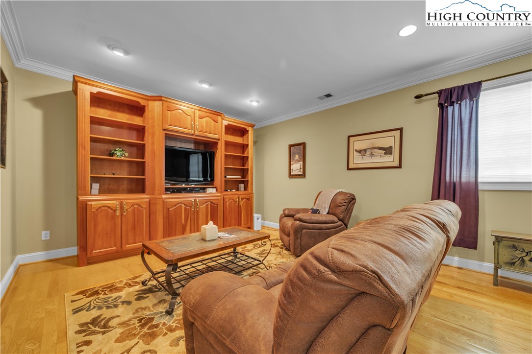 891 Olde Charter Circle Jefferson, NC 28640 - Photo 36 of 49 a bedroom with furniture and a flat screen tv