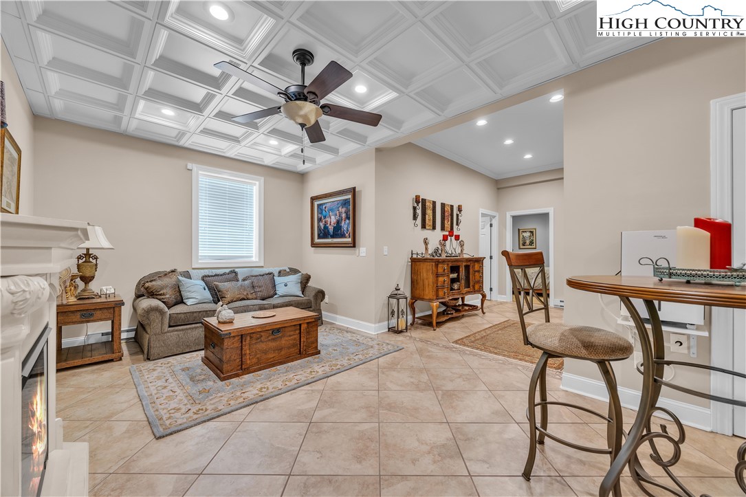 891 Olde Charter Circle Jefferson, NC 28640 - Photo 40 of 49 a living room with furniture and a flat screen tv