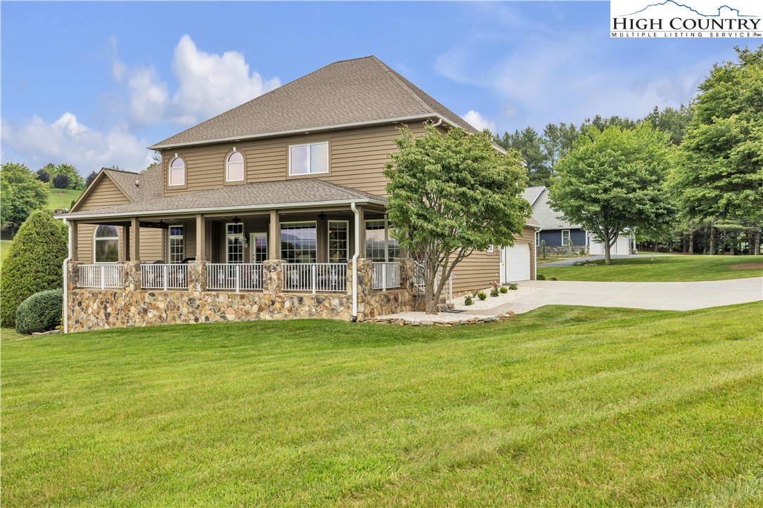 891 Olde Charter Circle Jefferson, NC 28640 - Photo 4 of 49 a view of a house with a yard