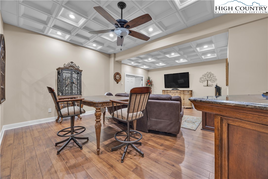 891 Olde Charter Circle Jefferson, NC 28640 - Photo 42 of 49 a view of a dining room with furniture wooden floor and chandelier