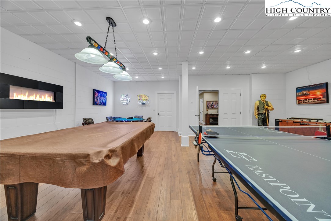 891 Olde Charter Circle Jefferson, NC 28640 - Photo 43 of 49 a room with furniture and a flat screen tv