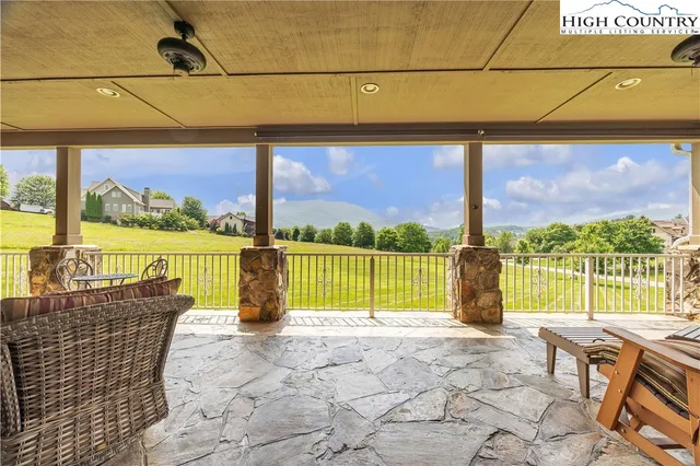 a view of swimming pool with a lounge chairs