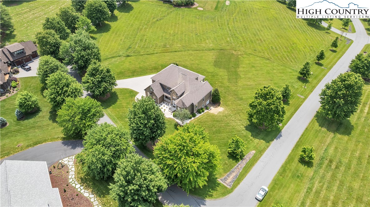 891 Olde Charter Circle Jefferson, NC 28640 - Photo 49 of 49 an aerial view of a residential apartment building with a yard