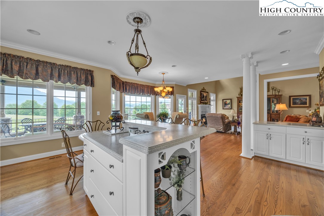 891 Olde Charter Circle Jefferson, NC 28640 - Photo 10 of 49 a view of a kitchen and dining room with wooden floor