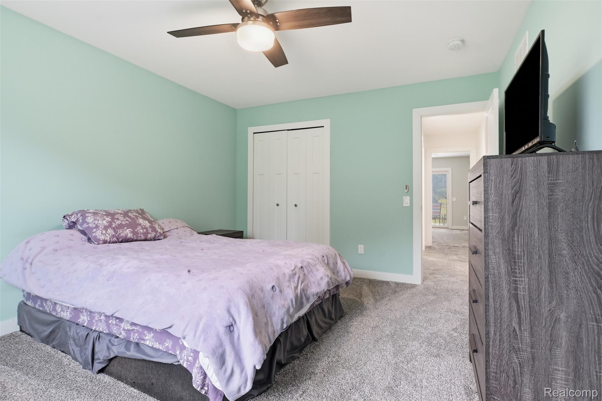 45738 Bemis Road Belleville, MI 48111 - Photo 29 of 52 Light-colored wall paint and neutral carpeting create a bright ambiance