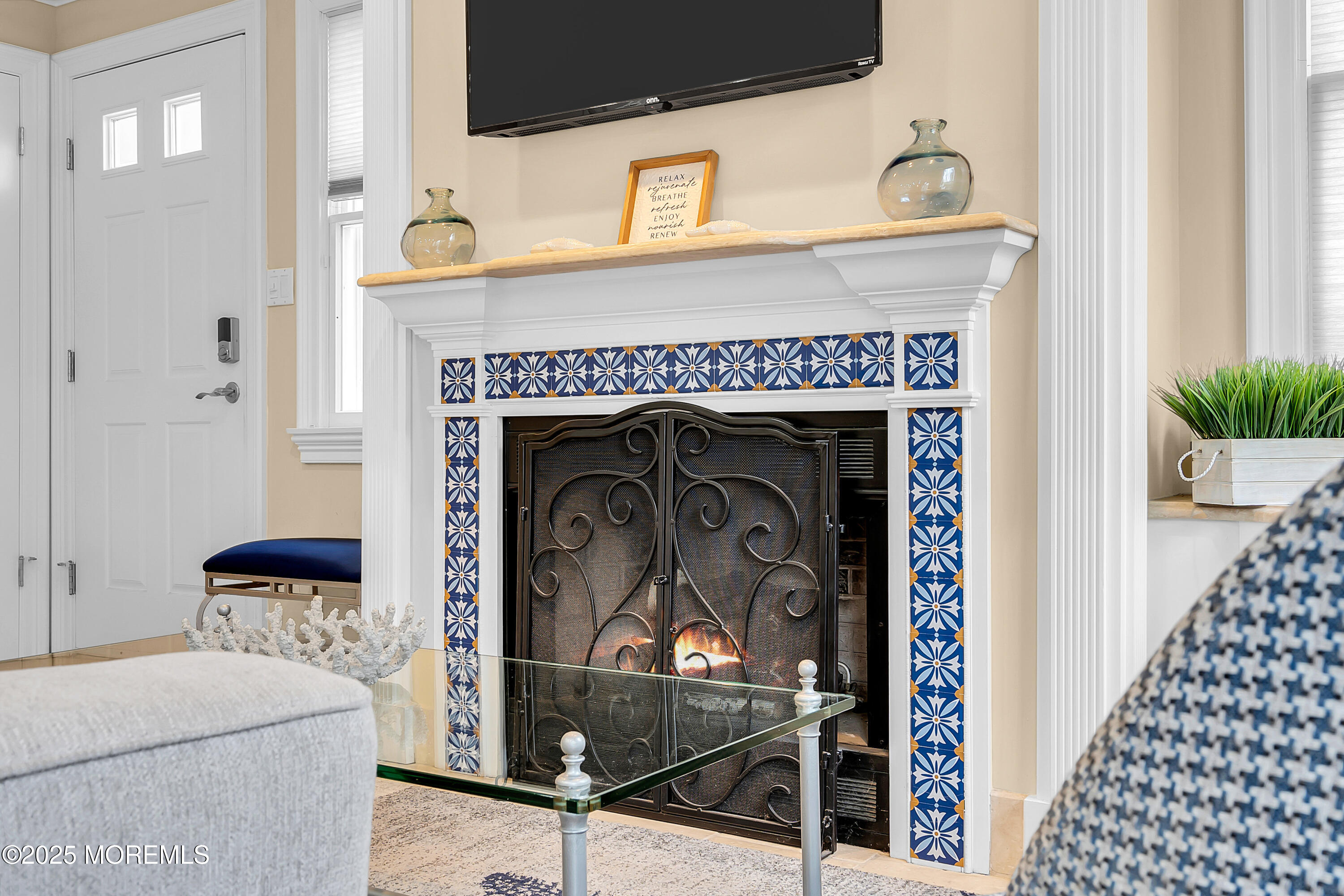 336 Lacey Road, Unit 36 Forked River, NJ 08731 - Photo 11 of 44 a living room with a fireplace and a table