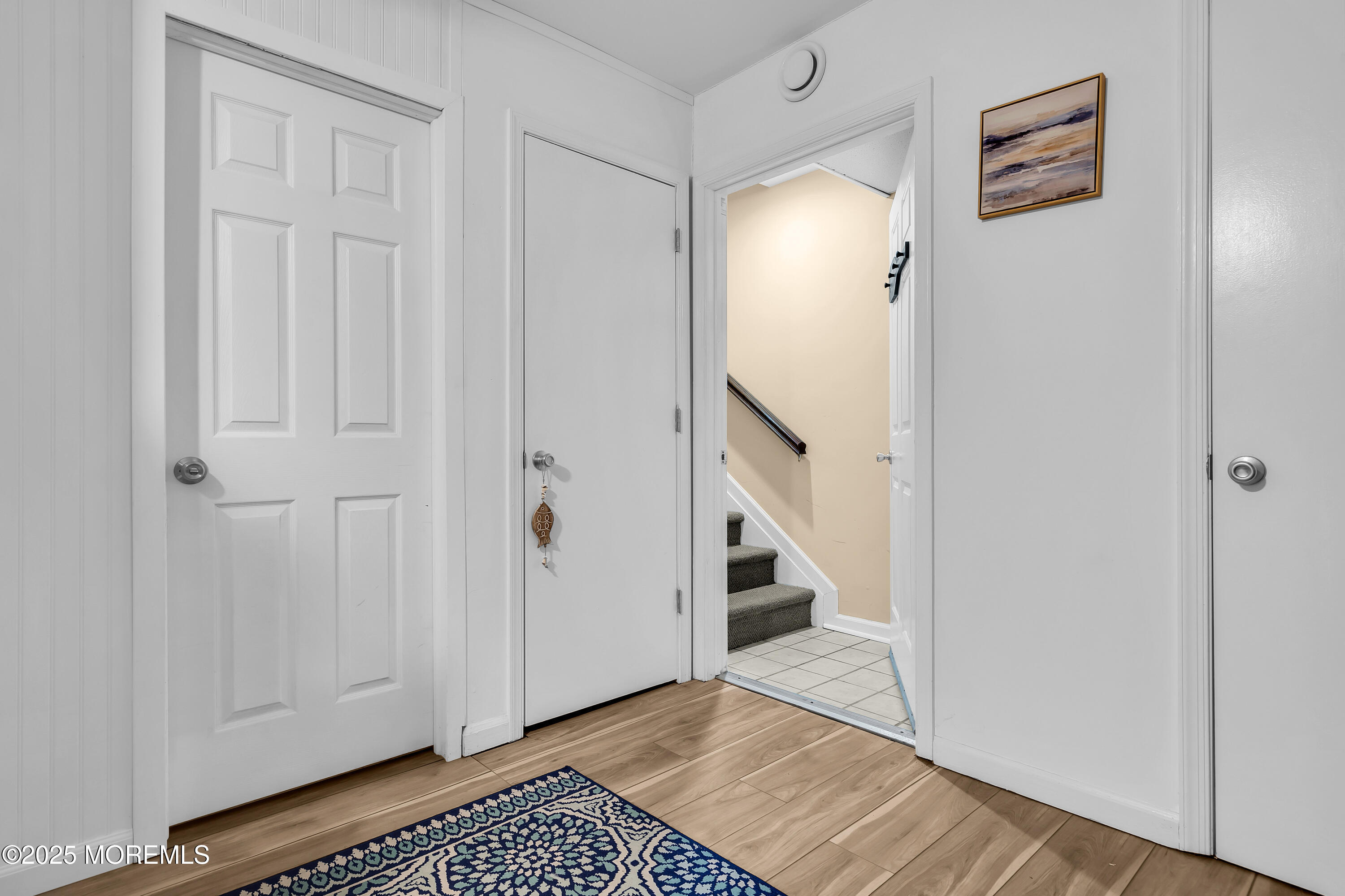 336 Lacey Road, Unit 36 Forked River, NJ 08731 - Photo 18 of 44 a view of a hallway with wooden floor and cabinets