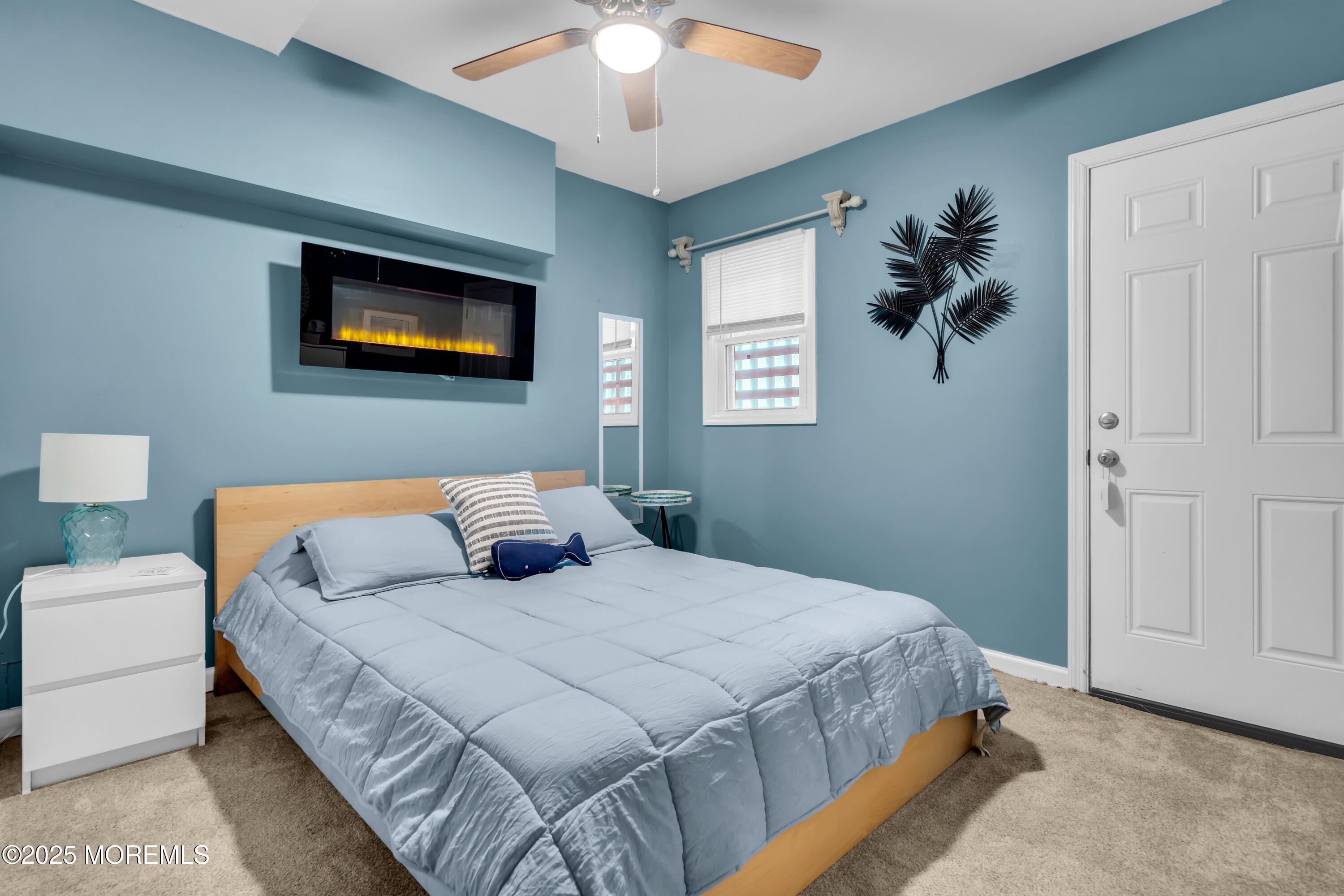 336 Lacey Road, Unit 36 Forked River, NJ 08731 - Photo 19 of 44 a bedroom with a bed and a painting on the wall