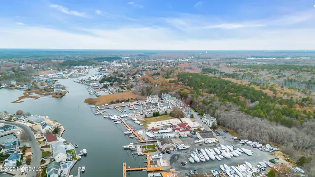 an aerial view of a city with ocean view