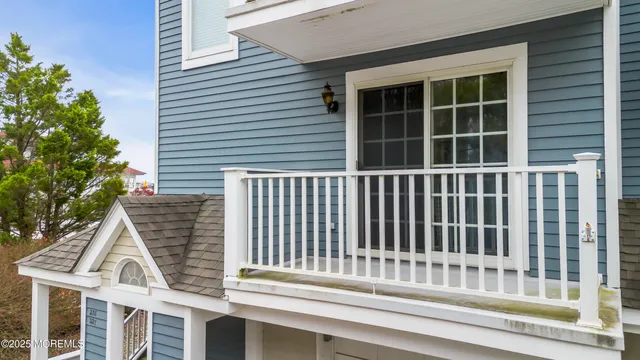 a view of a brick house with large windows