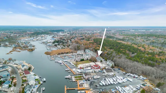 an aerial view of a house with a lake view