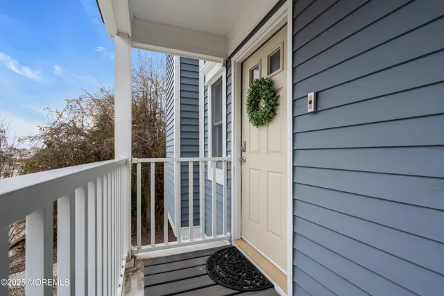 a view of a house with a door and wooden floor