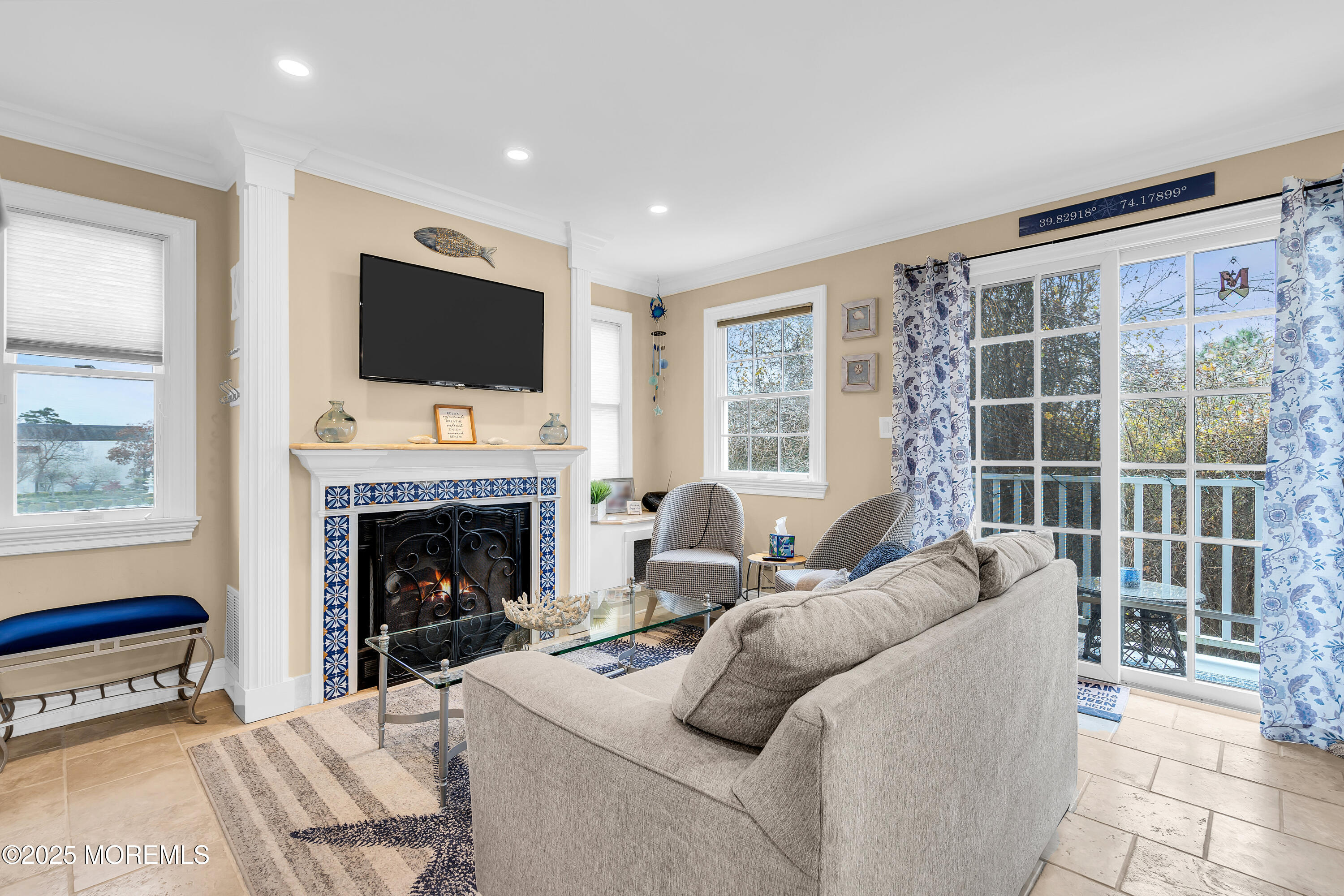 336 Lacey Road, Unit 36 Forked River, NJ 08731 - Photo 10 of 44 a living room with furniture a flat screen tv and a fireplace