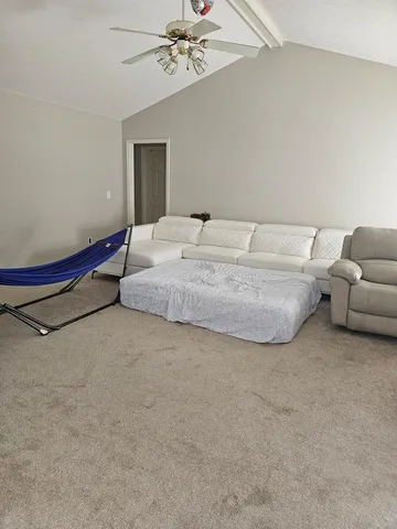 a bedroom with bed and window