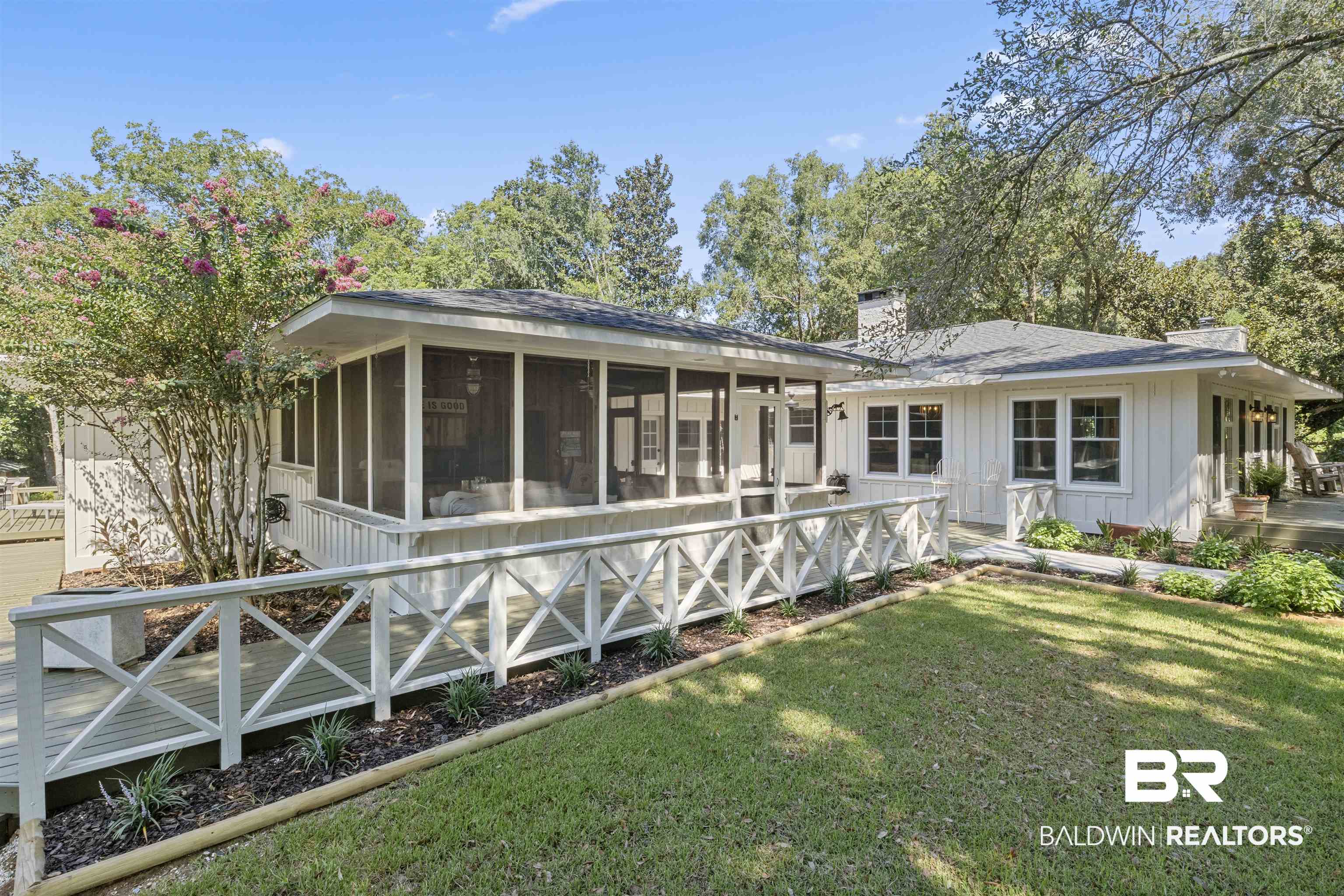 15100 Vasko Road Silverhill, AL 36576 - Photo 37 of 51 Rear view of property featuring a lawn and a sunroom