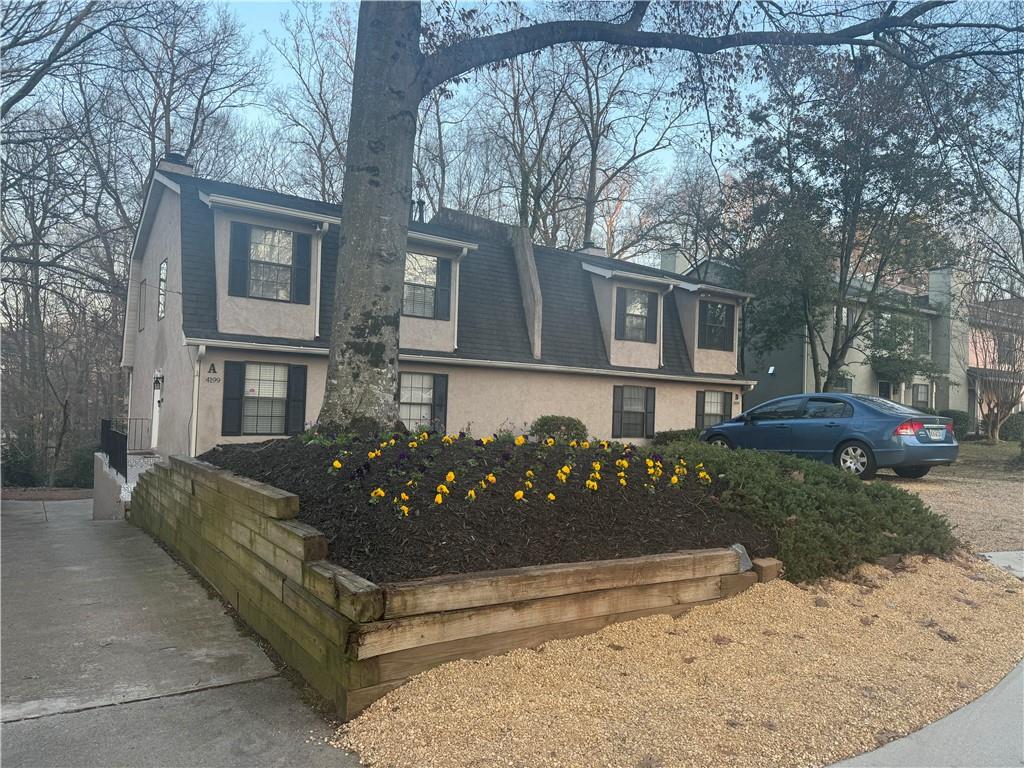 4199 North Shallowford Road, Unit A Atlanta, GA 30341 - Photo 1 of 1 a view of a house with a yard