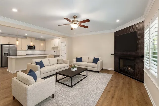 a living room with furniture and a fireplace