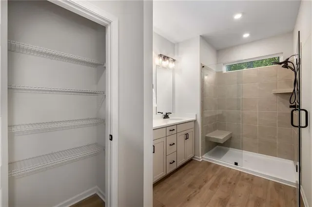 a bathroom with a bathtub and a shower