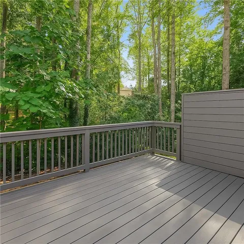 a view of balcony with wooden floor