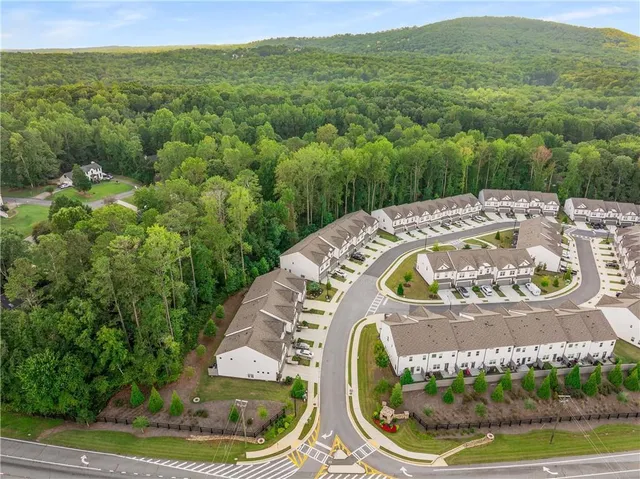 a view of a swimming pool with a yard
