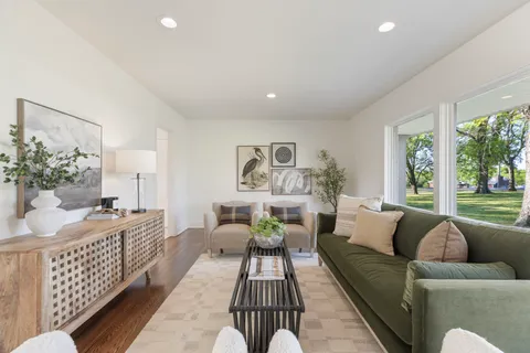 a kitchen with a stove top oven sink and cabinets