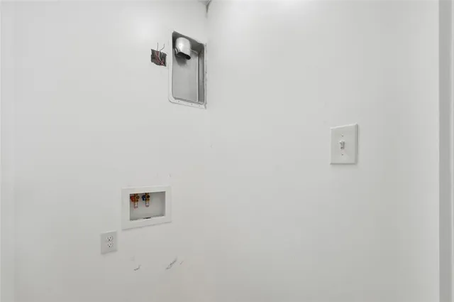 an empty room with wooden floor closet and ceiling fan