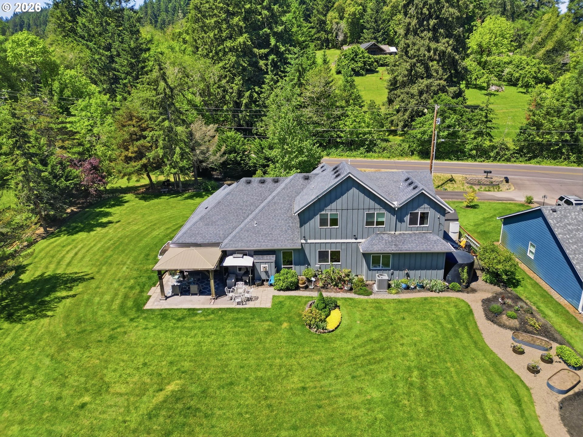 29778 Gimpl Hill Road Eugene, OR 97405 - Photo 42 of 43 an aerial view of a house with garden space and trees