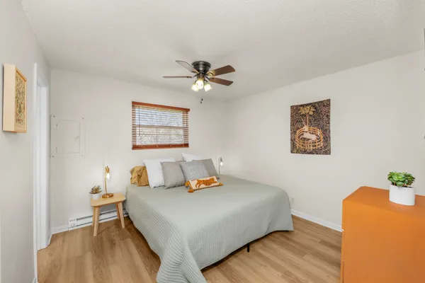 a bedroom with a bed and a table
