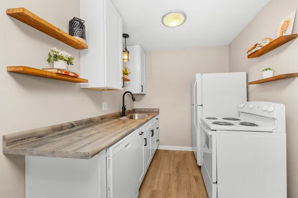 a kitchen that has a sink and a stove
