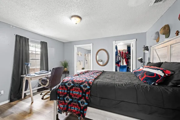 a bedroom with a bed and a closet