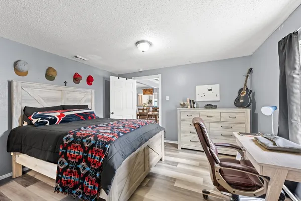 a bedroom with a bed and a table