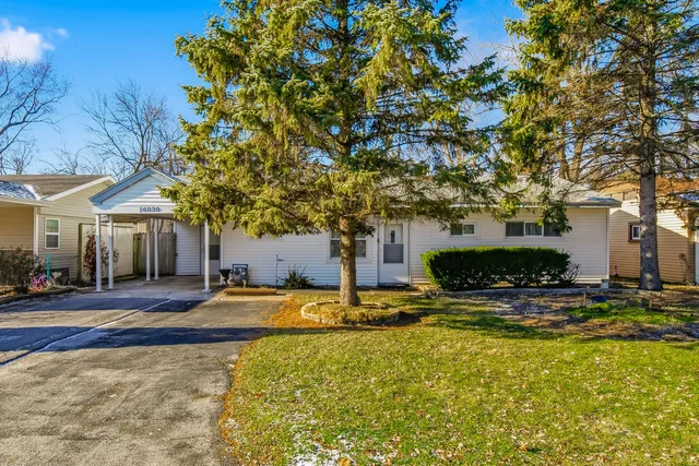 a view of a house with swimming pool and sitting area