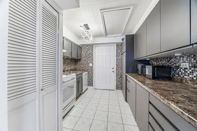 a kitchen with stainless steel appliances granite countertop a sink and cabinets