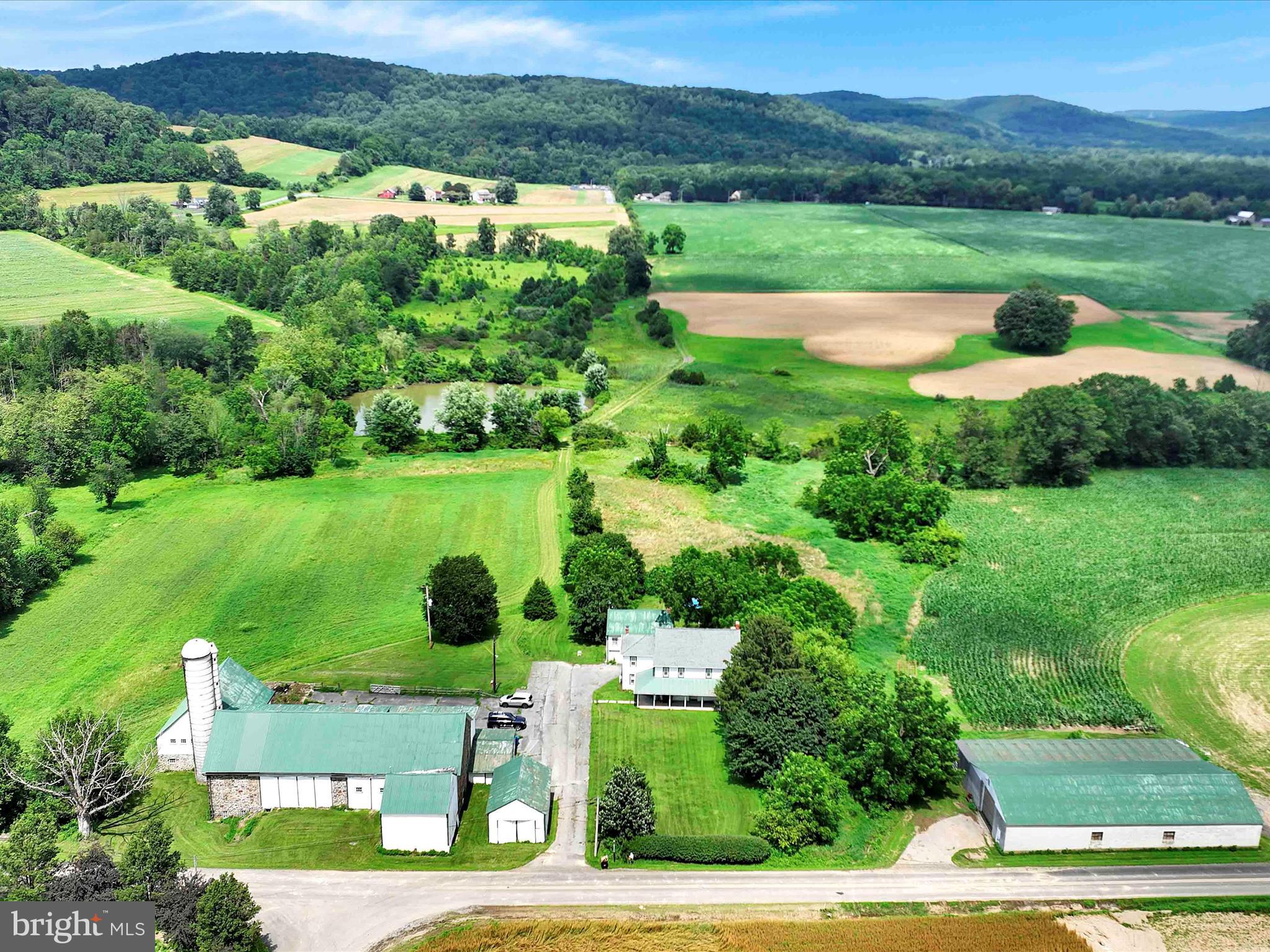 241 Mud Run Road Oley, PA 19547 - Photo 26 of 28 a view of a grassy field with an trees