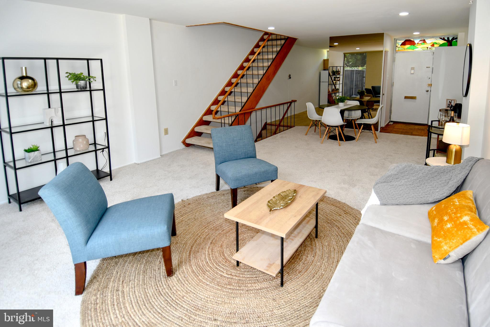 354 N Street Southwest, Unit 354 Washington, DC 20024 - Photo 13 of 48 a living room with furniture and wooden floor