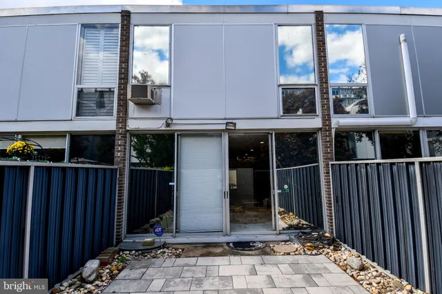 a living room with furniture and a lamps