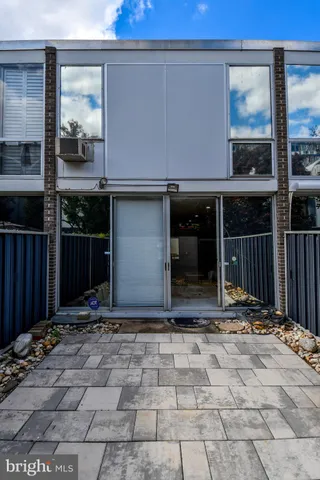 a view of a dining room with furniture and a rug