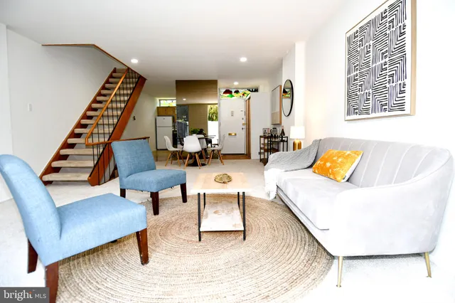 a bedroom with bed and wall painting with wooden floor