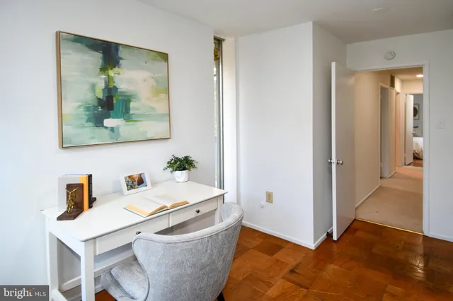 a bathroom with a glass door shower and a sink