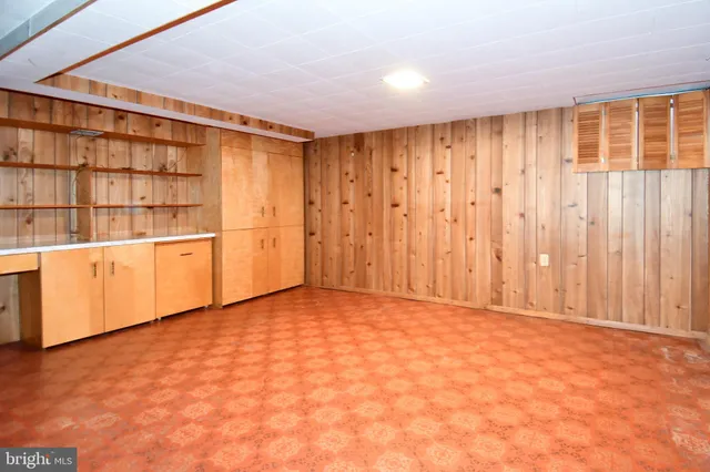 a view of a house with potted plants