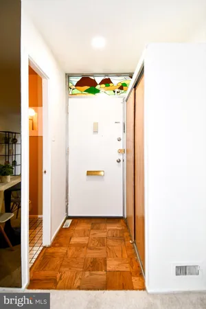 a kitchen with a refrigerator a stove a microwave and cabinets
