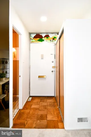 a kitchen with a refrigerator a stove a microwave and cabinets