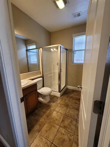 a view of livingroom and dining room with a couch