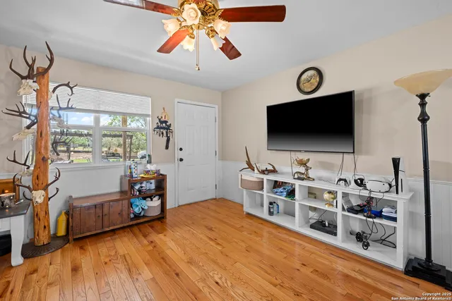 a room with furniture and a flat screen tv