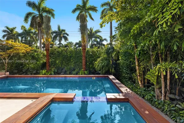 a view of swimming pool with a patio