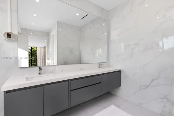 a view of a porch with furniture and garden